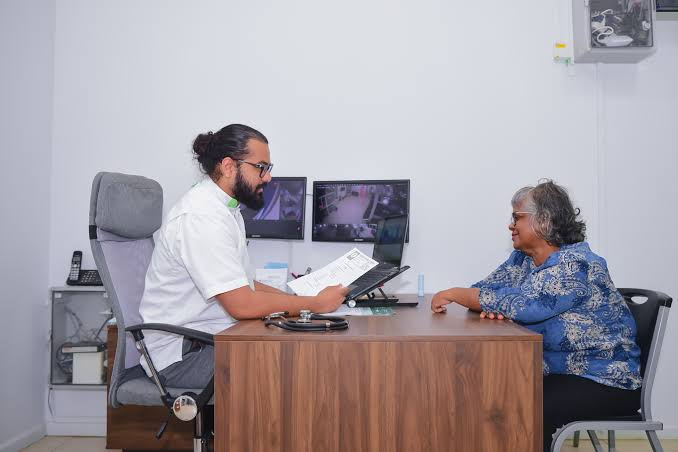 Doctor consulting with patient in modern clinic